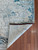 Corner of the rug is flipped up showing detail on the bottom. Corner of the rug is flipped up showing detail on the bottom.