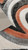 Corner of the rug is flipped showing the bottom. Corner of the rug is flipped showing the bottom.