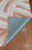 Corner of the rug is flipped up showing detail on the bottom of the rug. Corner of the rug is flipped up showing detail on the bottom of the rug.