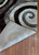 Corner of the rug is flipped up showing detail on the bottom. Corner of the rug is flipped up showing detail on the bottom.