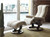 Stressless Piano Recliner with Ottoman- shown in a light colored fabric. Stressless Piano Recliner with Ottoman- shown in a light colored fabric.