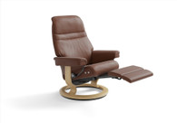 Copper Paloma Leather Stressless Sunrise Classic Power Recliner with ottoman in the raised position. 