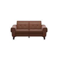 The front view of the Stressless Anna Powered Loveseat (A3 arms) in New Cognac Paloma leather with Wenge stained wood. 