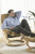 See Sven relax and recline in his Stressless Governor with a natural stained base.