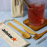<p>No waste living just got easier with the Bamboo Cutlery Set. The set includes a knife, fork, spoon, straw, and metal spoolie for cleaning the straw. All items in this set are biodegradable, sustainable, and eco-friendly. A must-have for everyone! Bundled up together in an easily portable canvas drawstring bag, just throw your new cutlery set in your handbag, backpack, or briefcase and never be caught trying to eat your lunch with your fingers again!</p>
<p>Please note: Because these utensils are made from natural bamboo, each one will need washing before first use. If there is any pith on the inside of a straw, it can be brushed out and then washed. Pith is totally natural, and edible so should not cause concern. Comes complete with a stainless steel cleaning brush with sisal bristles.</p>
<p>Please note that a standard digital transfer CMYK cannot match exactly PMS. To convert artwork colours from CMYK to PMS is $40.00 net per colour.</p>
<p>Product Features:</p>
<p>• Environmentally Friendly<br />
• Perfect for lunch on-the-go<br />
• Sustainable and Durable design<br />
• Plastic free</p>
<p>Product Details:</p>
<p>• Dimensions: 70mm W x 214mm H<br />
• Material: Bamboo<br />
• Packaging: Canvas drawstring bag.</p>
<p>Product care:</p>
<p>Bamboo is commonly referred to as a “wonder” material, and its characteristics make it difficult for liquids to absorb, making cleaning a breeze. Simply hand wash with soapy water and you’re good to go.</p>
