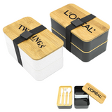 <p>Lunch in luxury with the Two Layer Lunch Box by Promo Brands. Style, organisation and convenience combine in this premium promotional product, celebrating texture and design. The first layer features a divider to keep food separate, with a larger compartment in the second layer as well as an included cutlery set. Your client will love the everyday use of this functional design – get in touch with us today to learn more!</p>
<p>Features:</p>
<p>• Eco Friendly Bamboo<br />
• Dual lunch compartments stack neatly and are secured with an elastic strap<br />
• Included are a plastic, knife, fork and spoon<br />
• The compartments are constructed of 30% wheat straw &amp; 70% polypropene<br />
• Microwave safe<br />
• Dishwasher safe excluding the bamboo lid</p>
<p>Please note: The accompanying elastic strap may interfere with your imprint, depending on imprint method, size and placement within the max imprint dimensions. If this product is engraved the colour and texture will vary from piece to piece due to the nature of the material.</p>
<p>Please note: The layer under the wood is meant to be used as the small cutting board unless the wood is printed with food safe ink or laser engraved.</p>
<p>We can laser engrave however please note no two products will have the same outcome. We encourage Food Grade Ink, which is FDA approved.</p>
<p>Food Safe Ink Testing Here</p>
<p>Packaging: Paper bag, then cartons</p>
<p>Material: Bamboo + polypropene + Plant fiber</p>
