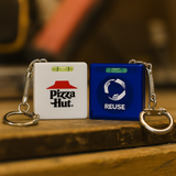 <p>This square-shaped tape measure packs more than just measurements. With a built-in level, metal tape, and keychain attachment, it’s a clever multitasker that measures up to 1 metre in both metric and imperial units. Compact, handy and ready to promote your brand with precision.</p>
