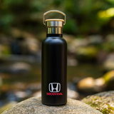 <p>The Shadow 500ml Water Bottle is built for those who want their drinks just the right temperature, for hours on end. With a 500ml capacity and double-walled stainless steel, this bottle keeps your beverages hot or cold with impressive insulation. It features a twist-off cap and a handy carrying handle for easy transport. Made from food-grade stainless steel and BPA-free, it’s a safe choice for everyday use. Each bottle comes neatly packaged in a minimalist kraft box. Hand wash only. Avoid freezing or microwaving.</p>
<p>Product Specifications:</p>
<p>• Double wall, vacuum insulated 18/8 stainless steel water bottle with copper lining<br />
• Copper-lining keeps drinks hot or cold for hours<br />
• Durable powder coated exterior that can be printed or laser engraved<br />
• Eco minded bottle and reusable<br />
• Free of BPA and phthalates</p>
<p>Keywords: Metal</p>

