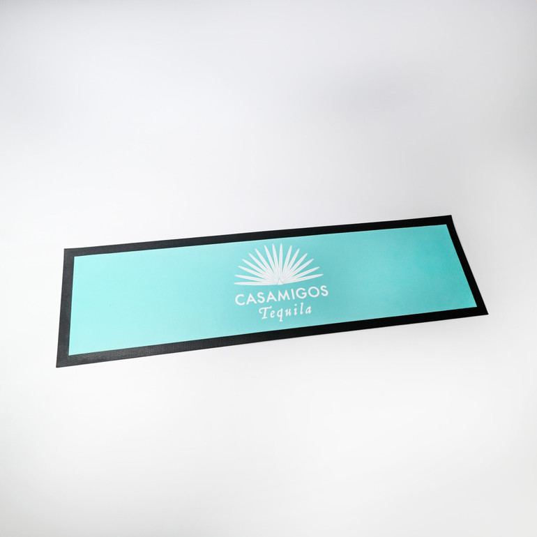 <p>This nitrile rubber bar runner is an absolute beauty. It has a super absorbent polyester surface that will handle spill after spill. Available in short run.</p>
<p>Disclaimer: Due to the way the bar runners are manufactured, there may be some difference in the placement of the artwork on the final product. As a result, borders may not be 100% centred, and artwork placed near the edge may vary in appearance between items.</p>
<p>Variable-data printing (VDP)</p>
<p>(Also known as variable-information printing (VIP) or VI) is a form of digital printing, including on-demand printing, in which elements such as text, graphics and images may be changed from one printed piece to the next, without stopping or slowing down the printing process and using information from a database or external file.</p>
<p>For example, a set of labels, each with the same basic layout, can be printed with a different name on each label. Variable data printing is mainly used for direct marketing, customer relationship management, advertising, invoicing and applying addressing on selfmailers, brochures or postcard campaigns.</p>
