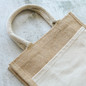 <p>The Jim Jam Tote Bag is big on space and even bigger on impact. Made with durable jute and built to handle the daily haul – whether it’s groceries, gear, or everything in between. Designed for those who want to cut back on plastic without cutting corners. Plus, every 100 units sold plants a native tree in Australian soil, making it a feel-good choice that does some real good.</p>
<p>What the bag is made of:</p>
<p>Body/Trim: 370gsm jute</p>
<p>Pocket: 270gsm canavs</p>
<p>Handle: cotton</p>
<p>Please note a standard digital transfer CMYK cannot be exactly PMS matched. To convert artwork colours from CMYK to PMS is $40.00 net per colour.</p>
<p>For digital transfer printing, please ensure art and colours are at full opacity.</p>
