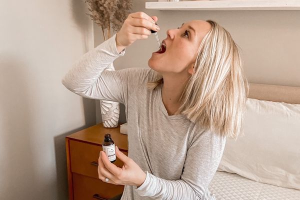 Woman using CBD oil