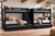 Dillon quadruple Twin bunk bed in black with center storage stairs and four sleeping spaces