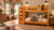 Lodge Barnwood Twin XL over Twin XL bunk bed with four-step solid wood staircase in Honey Pine finish