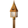 A Tudor Revival lantern post mount light fixture for a cottage, storybook, or fairy tale themed home made with warmly finished brass, a cross hatch pattern and white glass.