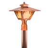 An Arts & Crafts style post mounted landscaping light fixture with a cupola, a dramatic taper, a raw copper finish and warm glass. The Craftsman fixture has wisteria artwork.