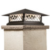 A classic, traditional sloped-roof column mounted pier light fixture with crown molding accent, a black finish and white glass. 
