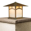 A linear, formal Craftsman column mounted pier lantern with an aging patina finish and warm glass. This Arts & Crafts fixture has window artwork on the body. 
