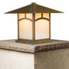 A linear, formal Craftsman column mounted pier lantern with an aging patina finish and warm glass. This Arts & Crafts fixture has a window pattern artwork on the body. 