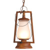 A rustic reproduction of a 19th-century, Dietz hot blast chain mounted pendant lantern from the frontier days of the Wild West with a rusty finish and frosted shade.