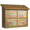 A large brass mailbox with an aged patina finish, iridescent glass and a cross design on the front panel. 