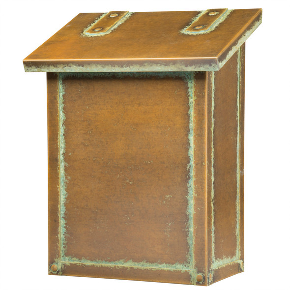 A classic, solid brass, vertically oriented mailbox with an aged patina finish. 