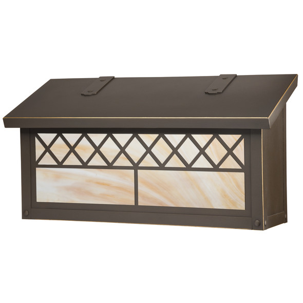 A brass mailbox with a bronze finish, warm glass and a string of diamonds across the front.