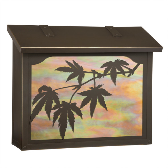 A large brass mailbox with a bronze finish, iridescent glass and Japanese Maple filigree artwork. 