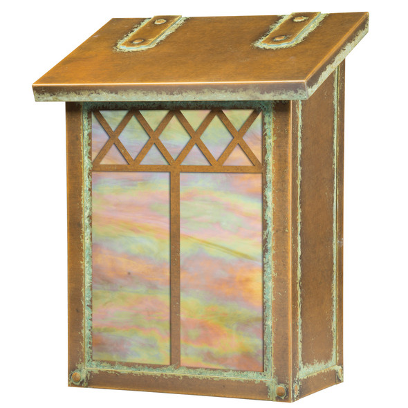 A vertical brass mailbox with an aged finish, iridescent glass and a diamond pattern.