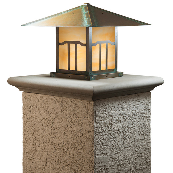 A linear, formal Craftsman column mounted pier lantern with an aging patina finish and warm glass. This Arts & Crafts fixture has an Asian cloud lift pattern artwork on the body. 