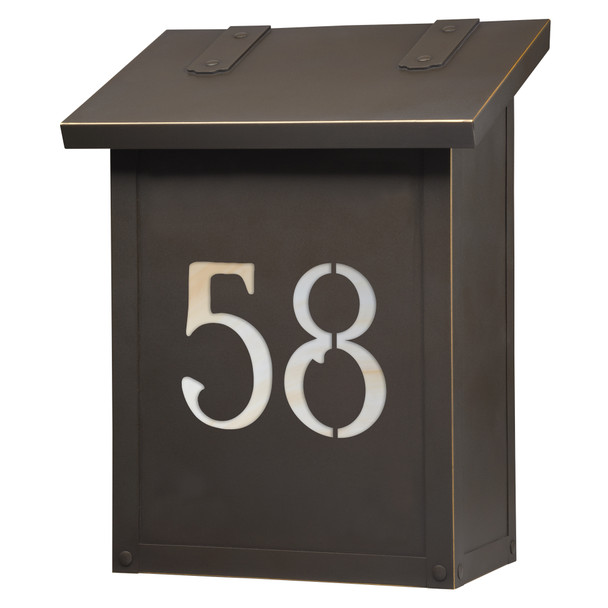 A classic, solid brass, vertical mailbox with an oil rubbed bronze finish and glass-backed house address numbers. 