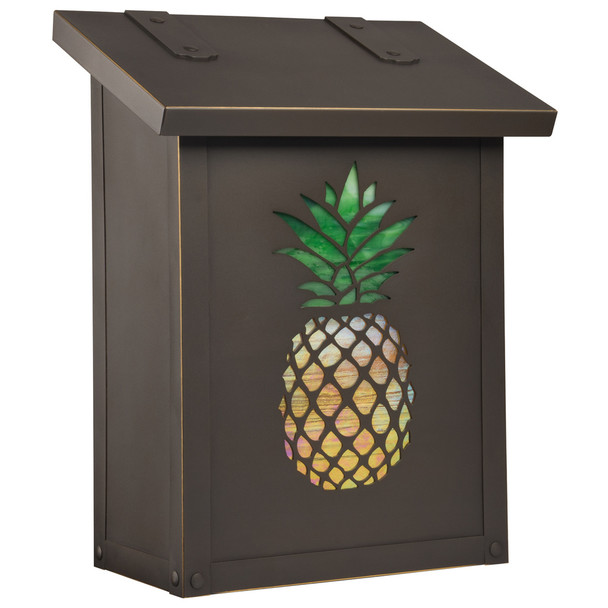 A solid brass, vertical  mailbox with an oil rubbed bronze finish and a glass-backed pineapple silhouette. 