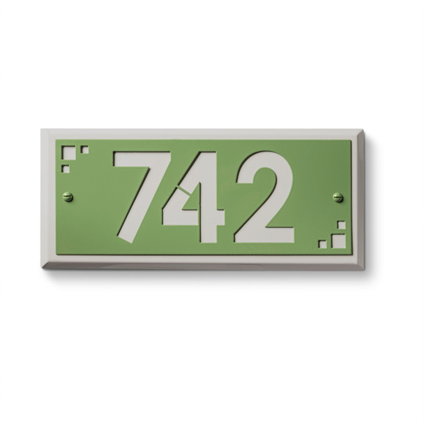 Modern address sign with green background featuring white cut-out numerals "742" and geometric corner accent elements in rectangular frame design. Premium exterior hardware with contemporary styling perfect for multi-family property identification 