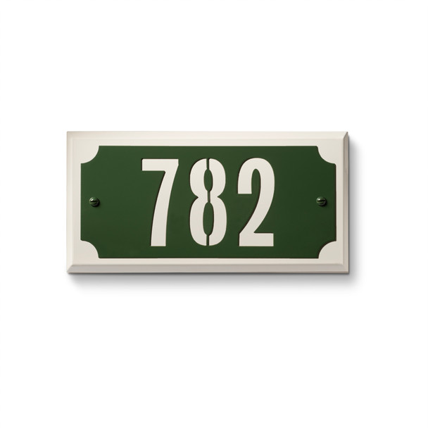 Traditional metal address sign with green background featuring white numerals "782" and classic corner cut design elements. American-made address plaque with timeless styling ideal for property management and multi-family applications 