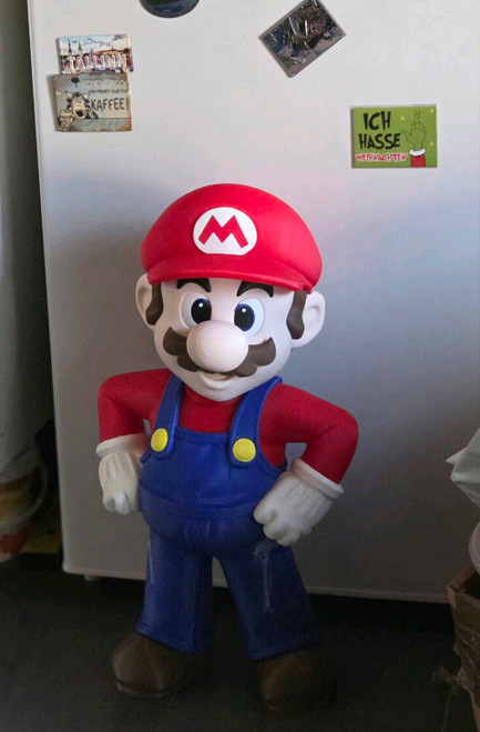 2ft tall Mario Nexus Nintendo edition will have black mustache brown hair and sideburns
