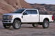 Fabtech 17-20 Ford F250/350 4WD Diesel 6in 4 Link System w/DL 2.25 Resi Shocks & Rear DL Shocks