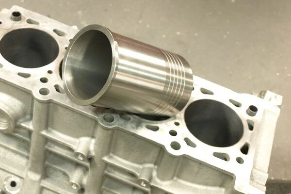 ATV, dirt bike, and UTV cylinder sleeving service installing a new engine sleeve for top‑end rebuilds