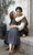 Fine Art Prints Bouguereau's A Little Coaxing, 16x26.5 inches, depicts a tender moment between two young girls sitting on a step with a potted plant.