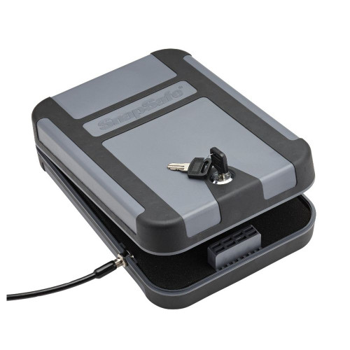 Keep your valuables secure with the Snapsafe Treklite Lock Box Key Lock 10x7x2 in Polycarbonate Gray. This portable lock box is made from durable polycarbonate and features a key lock mechanism for added security. Its compact and lightweight design makes it perfect for travel or home use, offering peace of mind wherever you are.