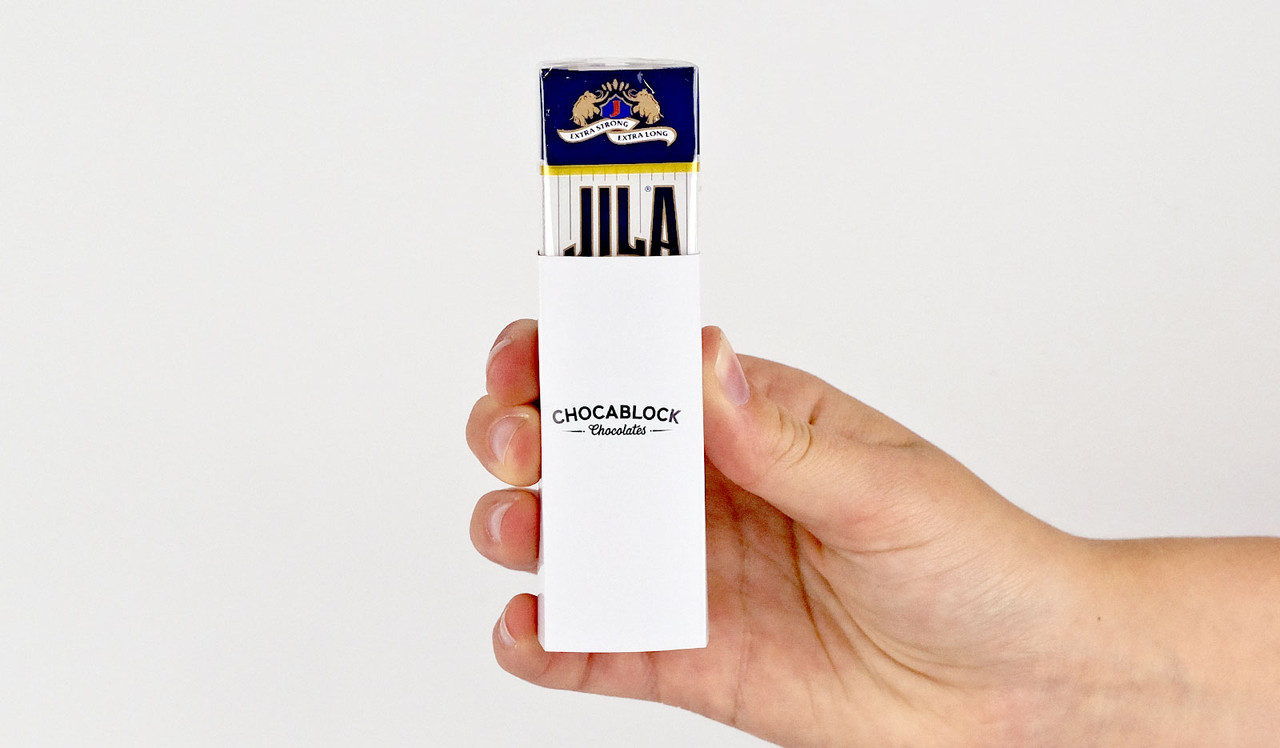 Model holding Jila Mints for sizing comparison