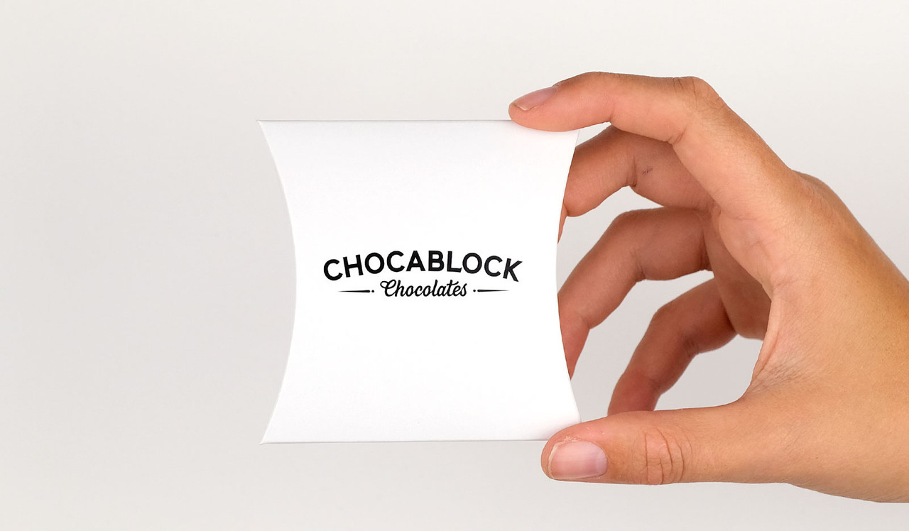 Model holding pillow box for size reference