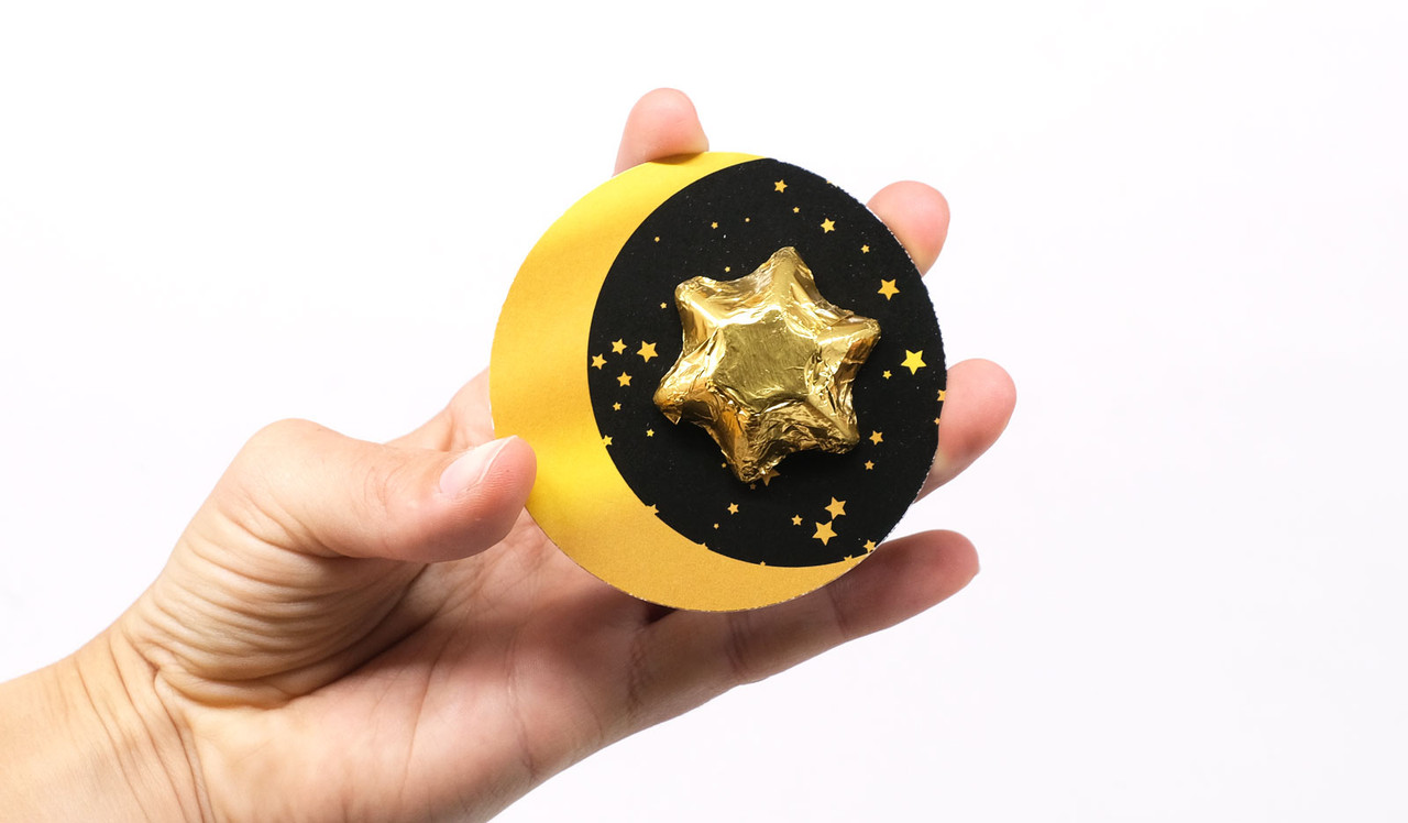 Model holding Moon Card for sizing purposes