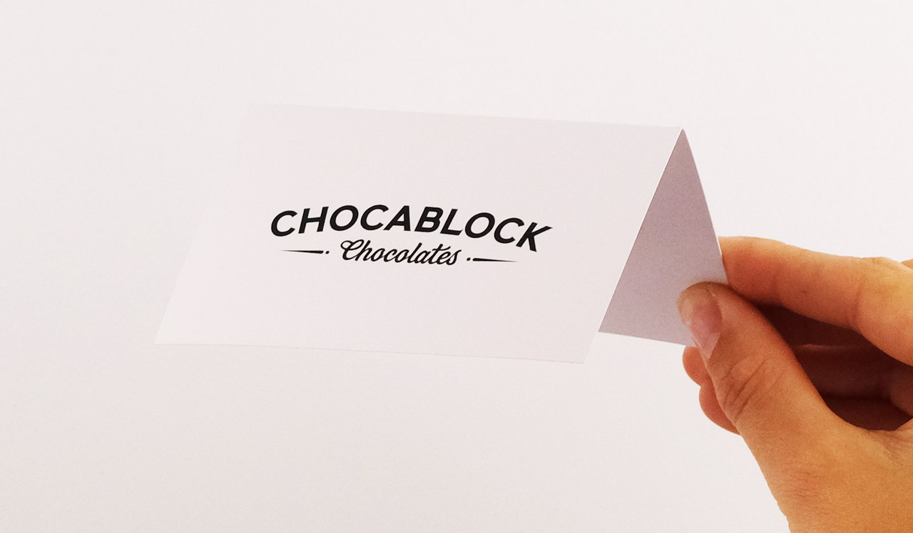 Model holding Place Cards With Guest Names Printed