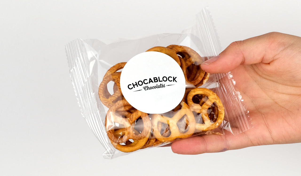 Model holding bag of personalised pretzels