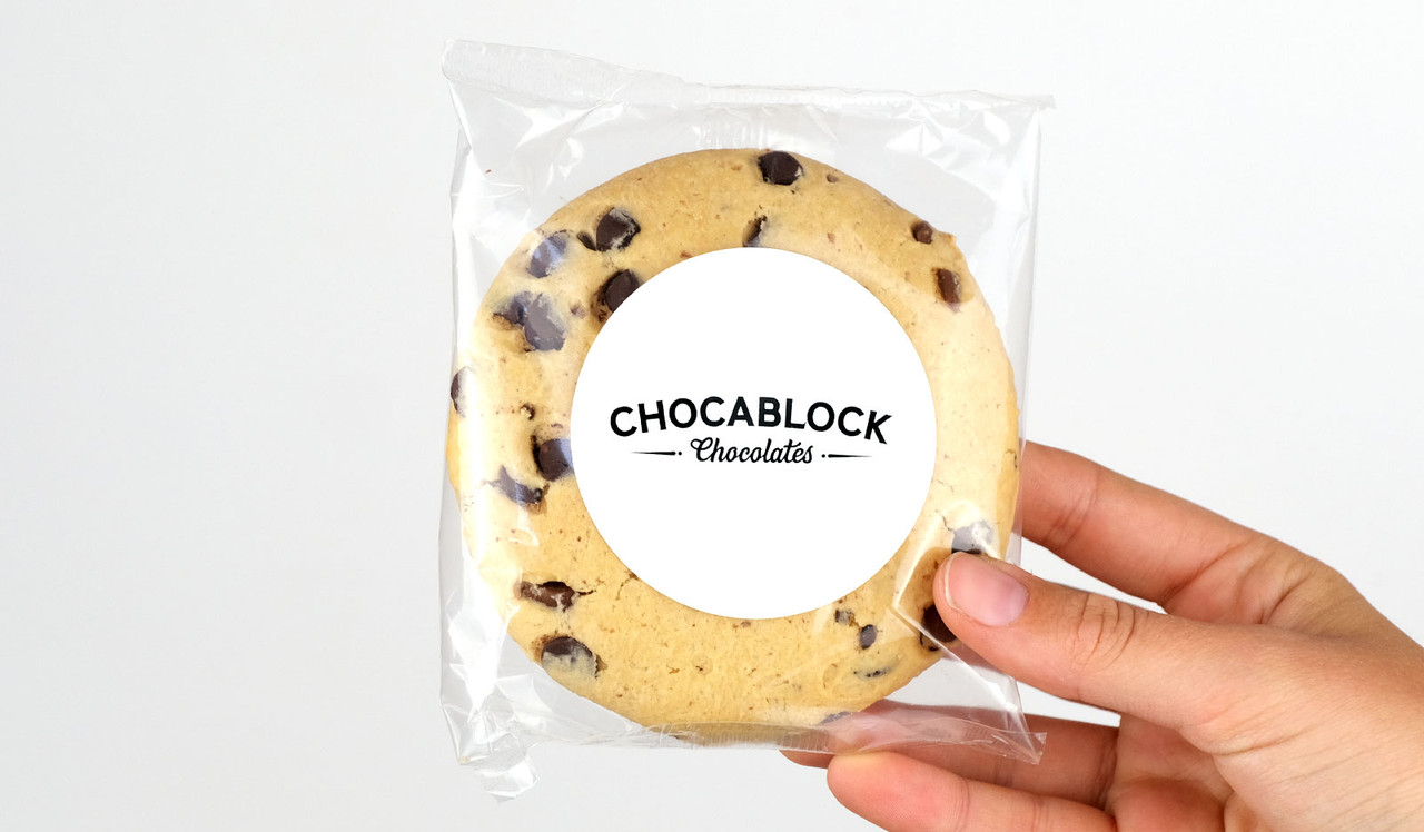 Model holding giant chocolate chip cookie