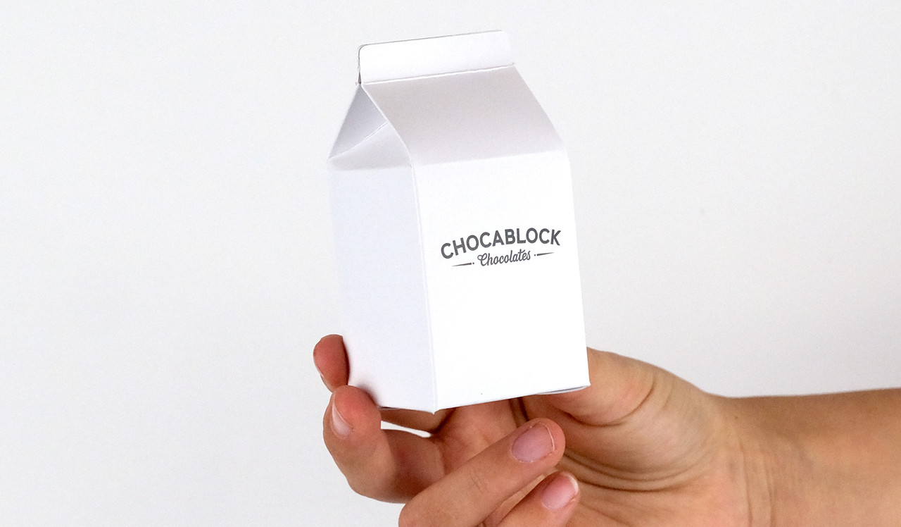 Model holding 10cm milk carton