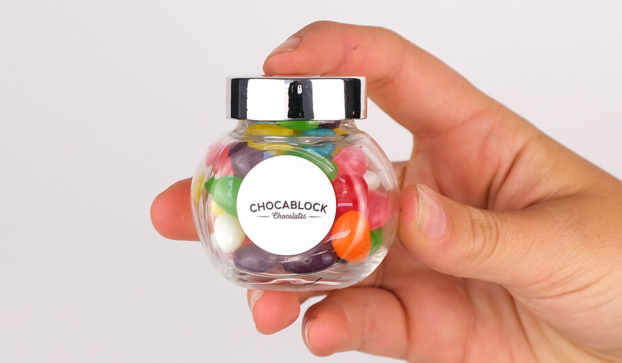 Model holding candy jar for sizing reference