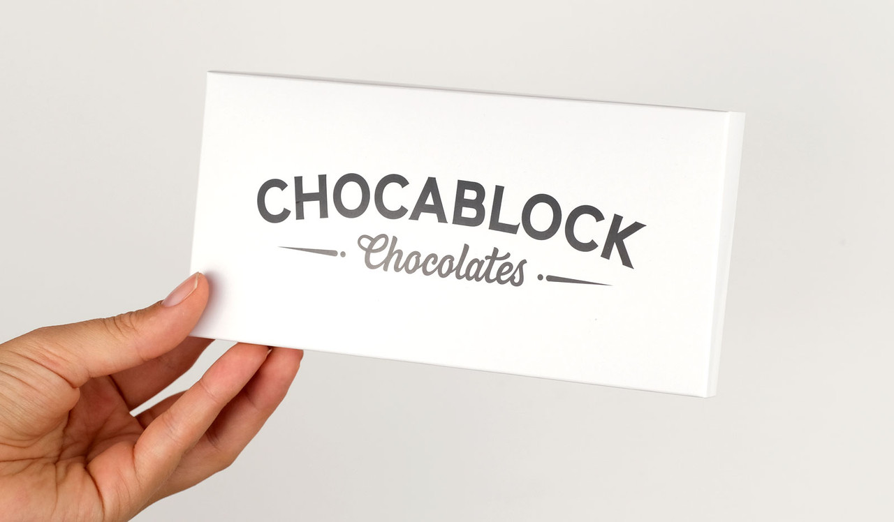 Model holding Cadbury Bar box for sizing purposes