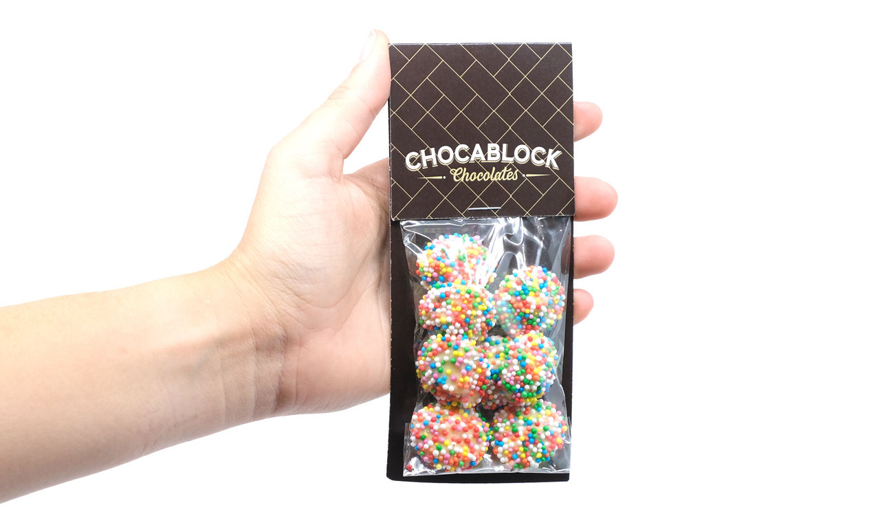 Model holding White Chocolate Mini Speckle Card