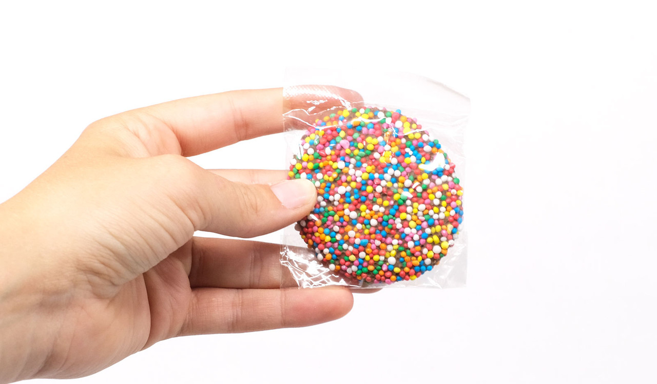 Model holding Personalised Big Chocolate Speckle 20g for display purposes