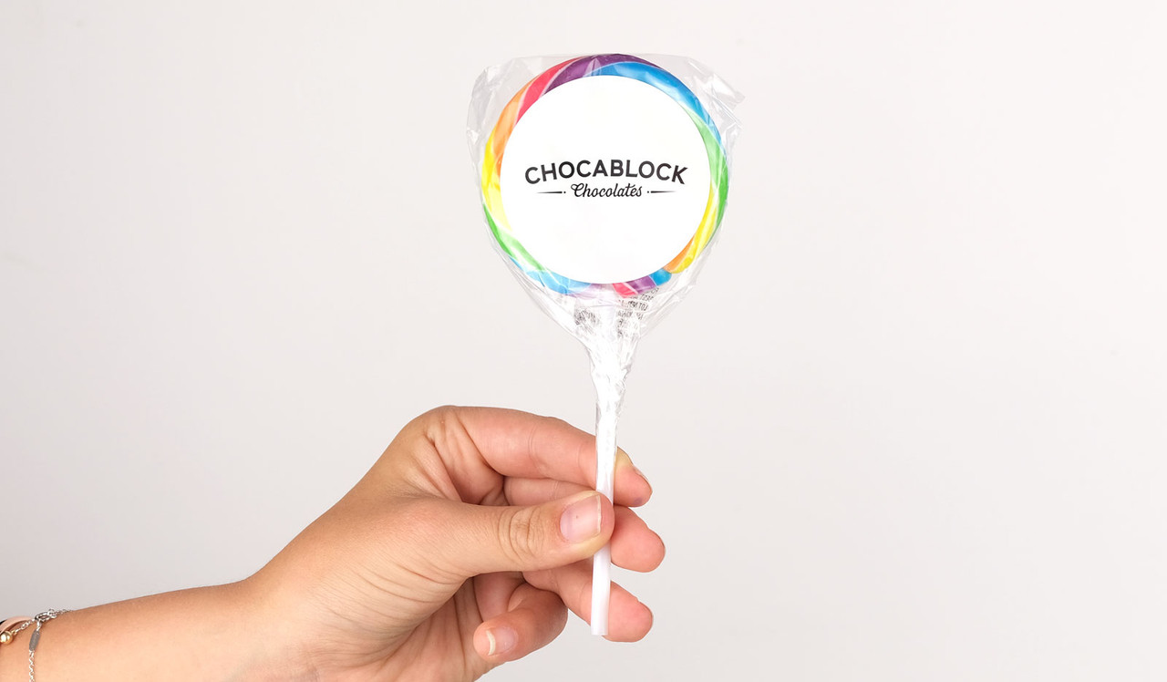 Model holding lollipop for size purposes
